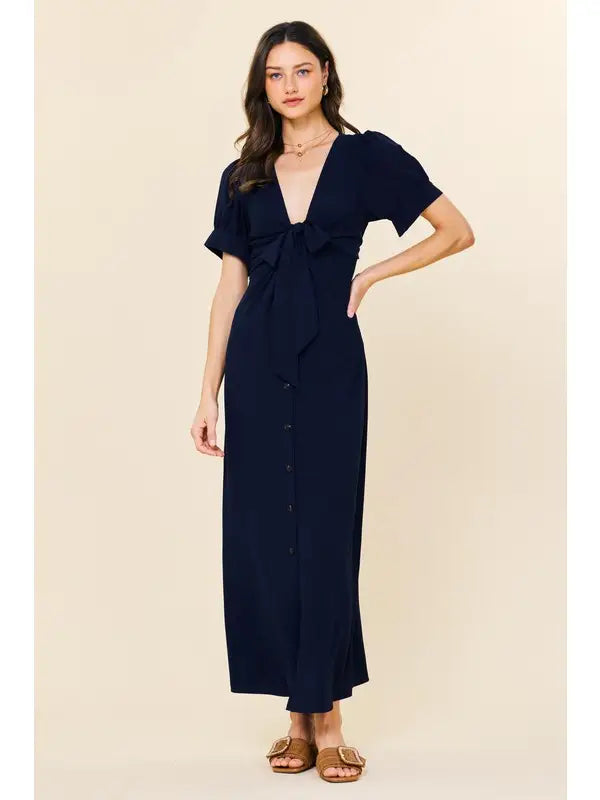 Navy button down midi dress.

X-Small (Size 2-4) Bust: &nbsp;33.5", Waist: &nbsp;26", Hips 36"
Small (Size 4-6) Bust: 35.5", Waist: &nbsp;27.5", Hips: 37.5"
Medium (Size 8-10) Bust: 37.5", Waist: &nbsp;29.5", Hips: 39.5"
Large (Size 12)Bust: 39.5" Waist: &nbsp;31.5", Hips: &nbsp;41.5"
100% Polyester
Delicate wash, hang to dry.
Made by Skies are Blue