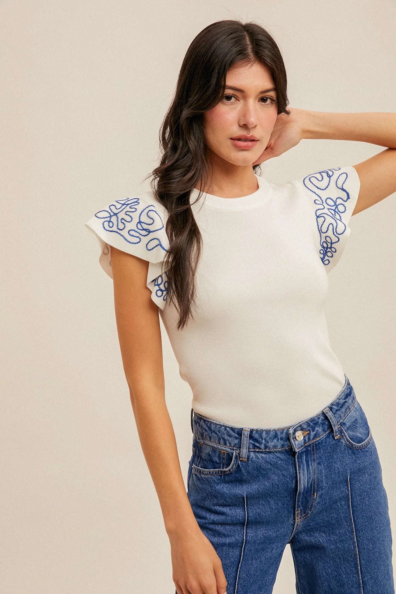 Lightweight woven top with blue embroidered ruffle sleeves.

Blue intricate embroidery on the sleeves.
Everyday breathable woven top.
70% Viscose, 30% Nylon
Small = 2-4 (Bust 35", Waist 27")
Medium = &nbsp;(Bust 37", Waist 29")
Large = (Bust 39", Waist 31")
Made by Hem and Thread.
THML