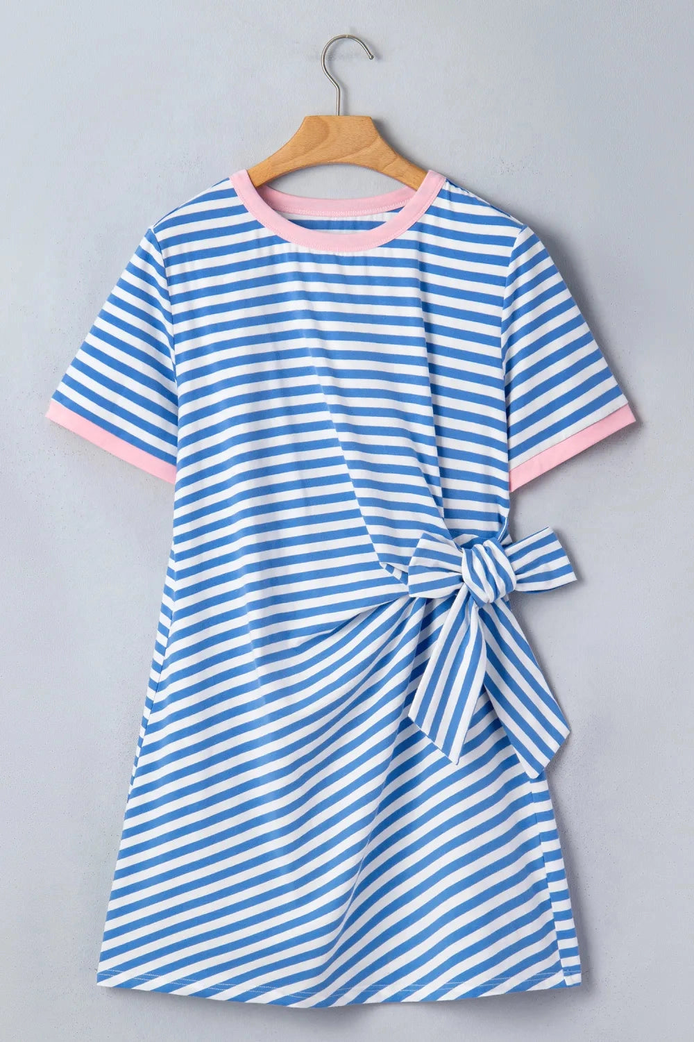 Crafted from a soft, high-stretch cotton blend.
Bold stripes make a statement, beautifully framed by contrast trim at the neckline and sleeves.
The self-tie waist detail lets you cinch and shape for a flattering fit that's uniquely yours.
Pair it with white sneakers for a casual weekend look or slip on sandals for a breezy, laid-back vibe that feels both put-together and relaxed.&nbsp;
Delicate wash, hang to dry.