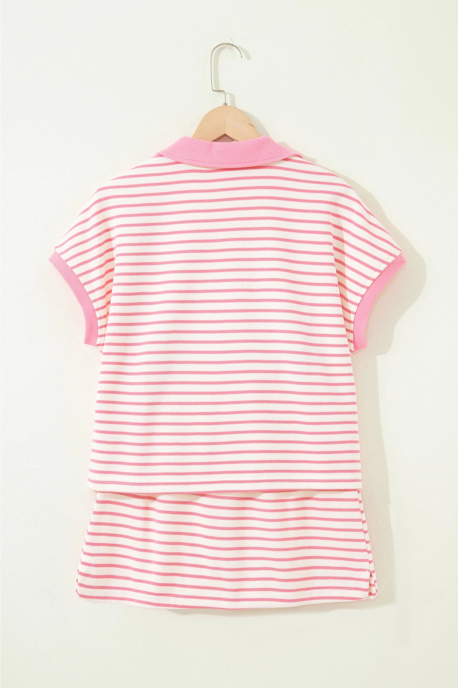Pink polo striped skort set.

Medium (Size 8-10) Bust: 43", Skort Length: 15", Waist: 28.7"
Crafted from a soft, polyester cotton blend.
Charming two-piece set that effortlessly blends preppy style with everyday comfort.
Classic striped polo top features a crisp ribbed collar and short sleeves, perfectly paired with a drawstring elastic waist mini skort complete with built-in shorts for versatile wear.
Crafted from soft, breathable cotton-blend fabric, this set keeps you cool and comfortable through warm da