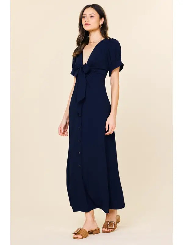 Navy button down midi dress.

X-Small (Size 2-4) Bust: &nbsp;33.5", Waist: &nbsp;26", Hips 36"
Small (Size 4-6) Bust: 35.5", Waist: &nbsp;27.5", Hips: 37.5"
Medium (Size 8-10) Bust: 37.5", Waist: &nbsp;29.5", Hips: 39.5"
Large (Size 12)Bust: 39.5" Waist: &nbsp;31.5", Hips: &nbsp;41.5"
100% Polyester
Delicate wash, hang to dry.
Made by Skies are Blue