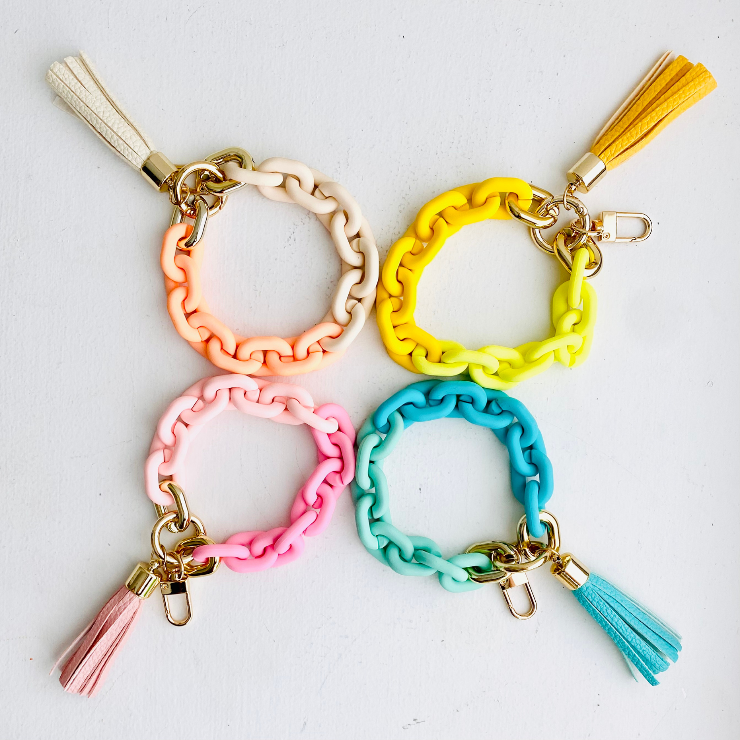 These adorable bangle keychains are perfect for the girl who's always got her hands full!

• Non-elastic

• Small-sized tassels

• Vibrant colors

• High quality resin&nbsp;