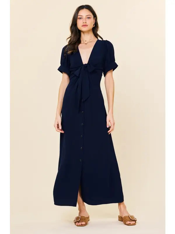 Navy button down midi dress.

X-Small (Size 2-4) Bust: &nbsp;33.5", Waist: &nbsp;26", Hips 36"
Small (Size 4-6) Bust: 35.5", Waist: &nbsp;27.5", Hips: 37.5"
Medium (Size 8-10) Bust: 37.5", Waist: &nbsp;29.5", Hips: 39.5"
Large (Size 12)Bust: 39.5" Waist: &nbsp;31.5", Hips: &nbsp;41.5"
100% Polyester
Delicate wash, hang to dry.
Made by Skies are Blue