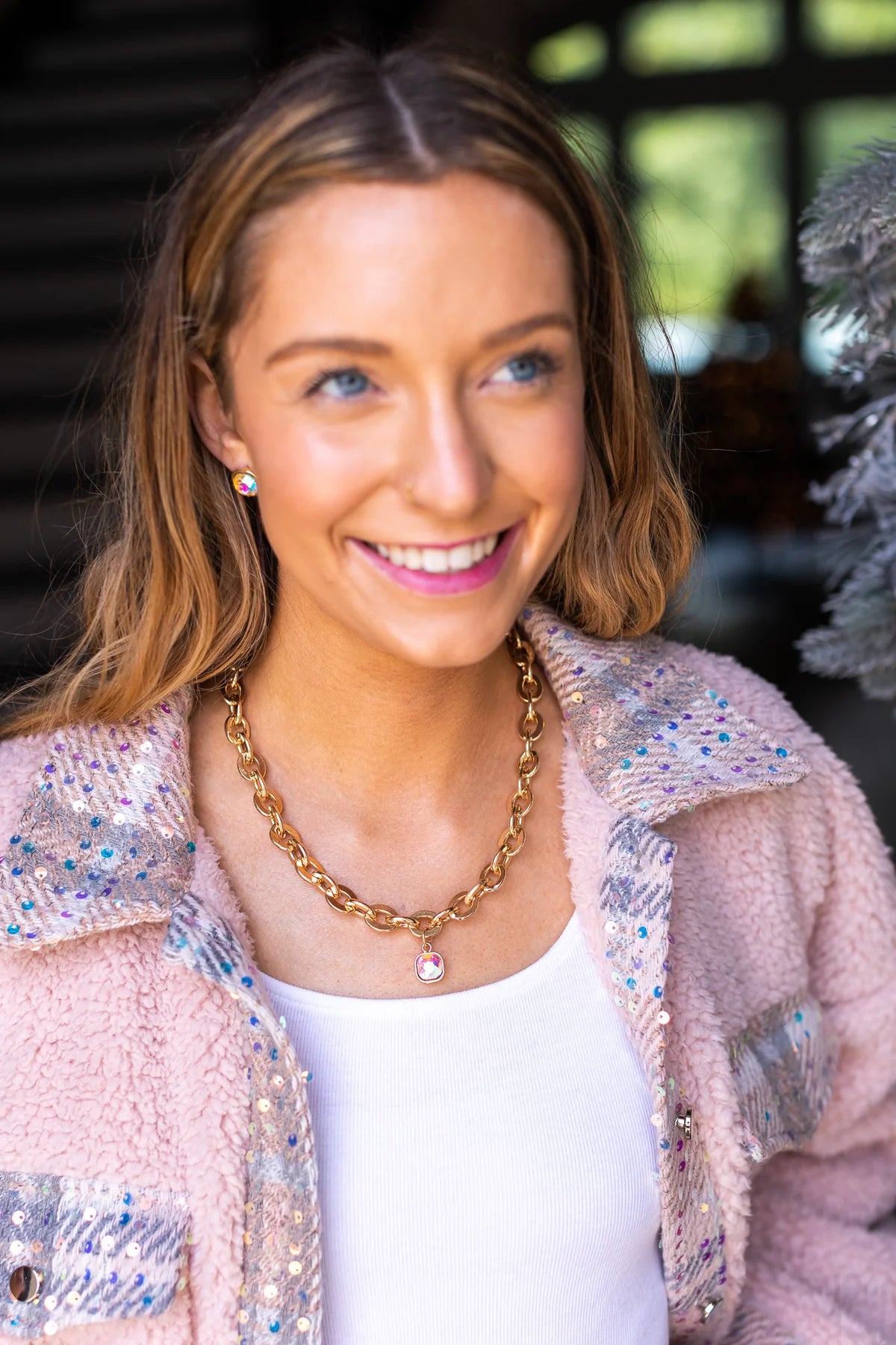 Gold chain necklace with square crystal.