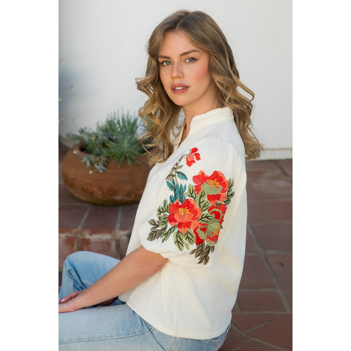 Soft cream top with embroidered puff sleeves by THML.&nbsp;

Embroidered sleeves are exquisite!
True to size.
95% Polyester, 5% Spandex
Cool delicate wash, lay flat to dry, NO dryer
Made by THML