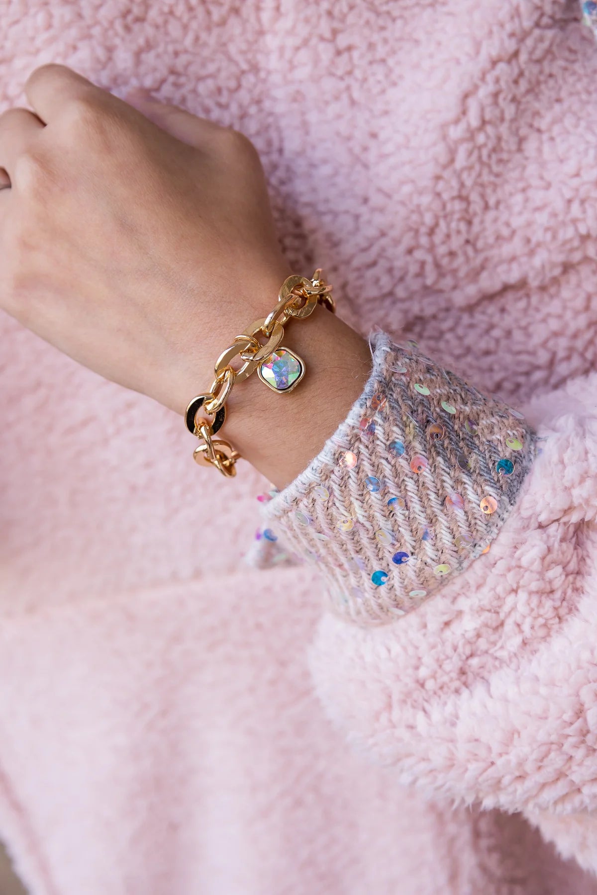 Gold chain bracelet with square crystal.