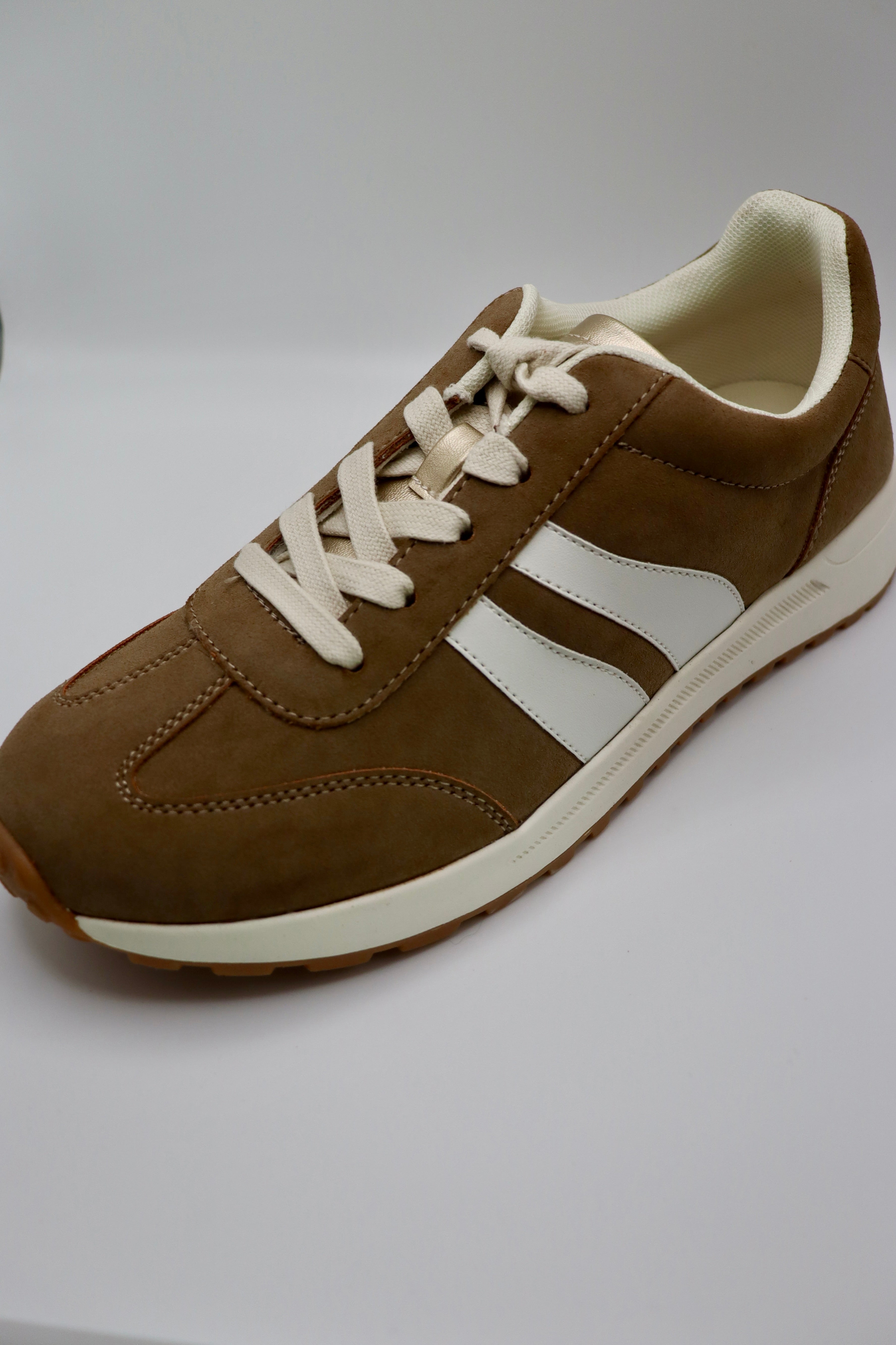 Comfy, stylish mocha sneakers by Jellypop.
New Balance
Memory foam insoles.
Made by Jellypop.