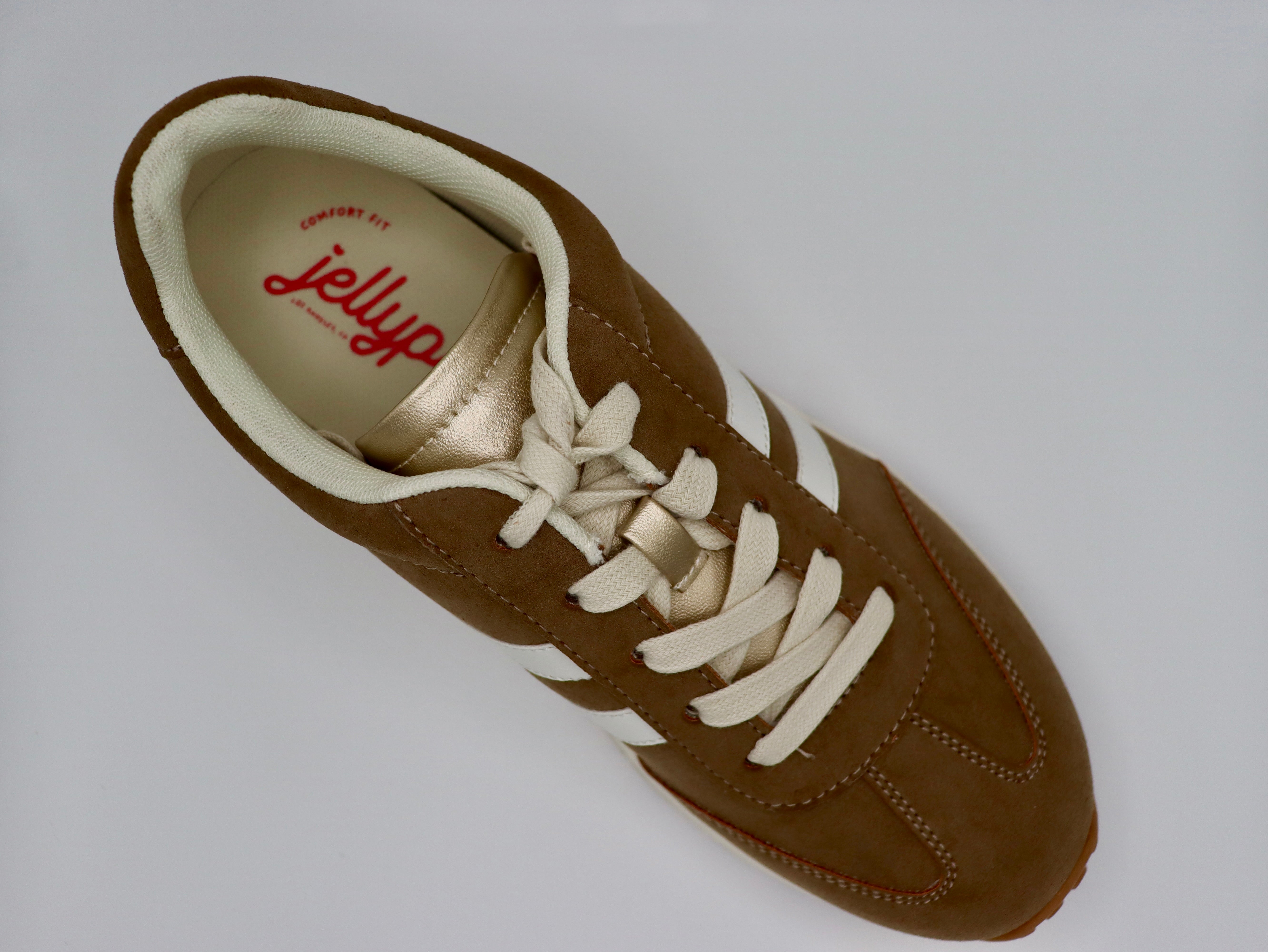 Comfy, stylish mocha sneakers by Jellypop.
New Balance
Memory foam insoles.
Made by Jellypop.