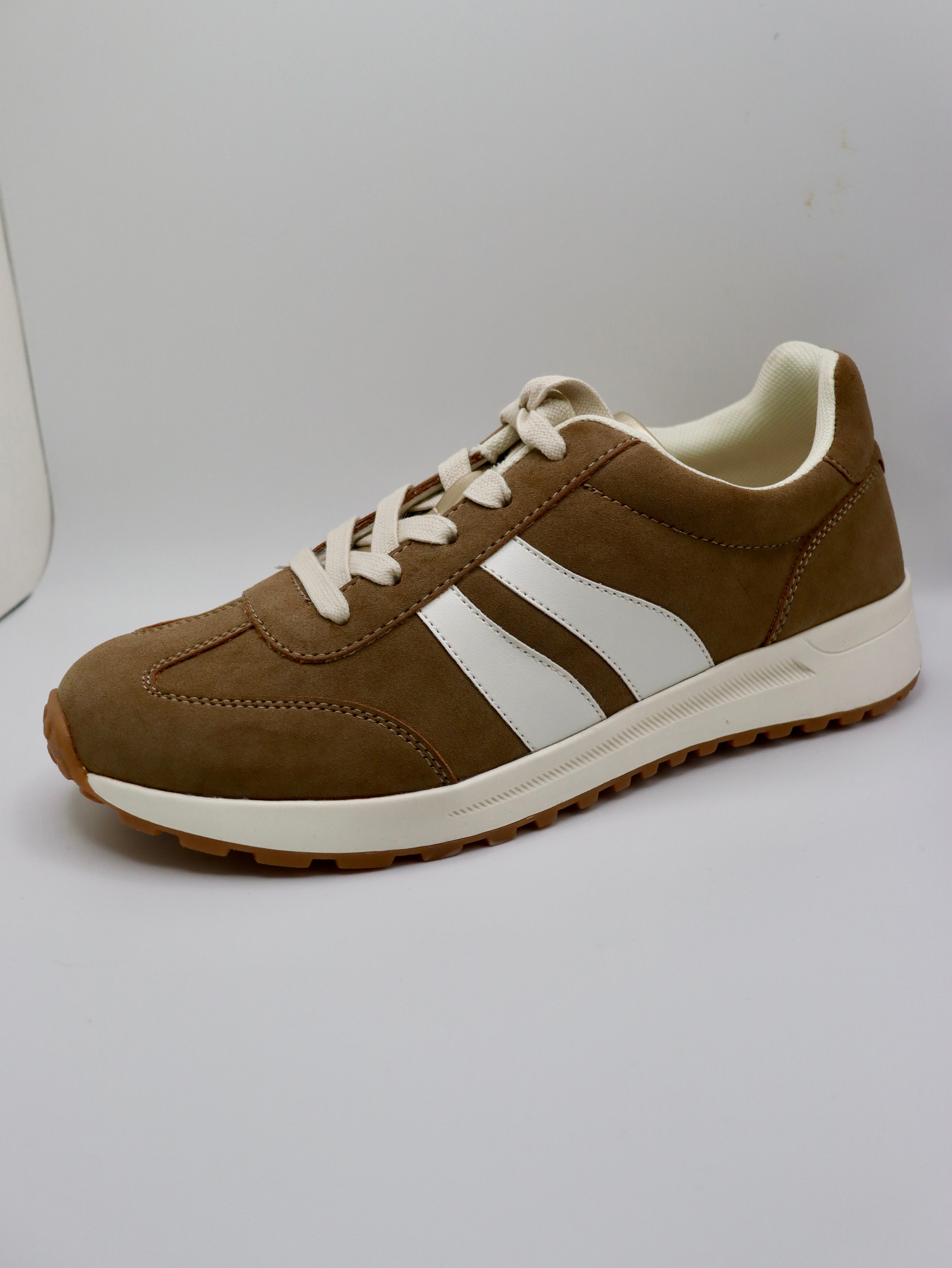 Comfy, stylish mocha sneakers by Jellypop.
New Balance
Memory foam insoles.
Made by Jellypop.