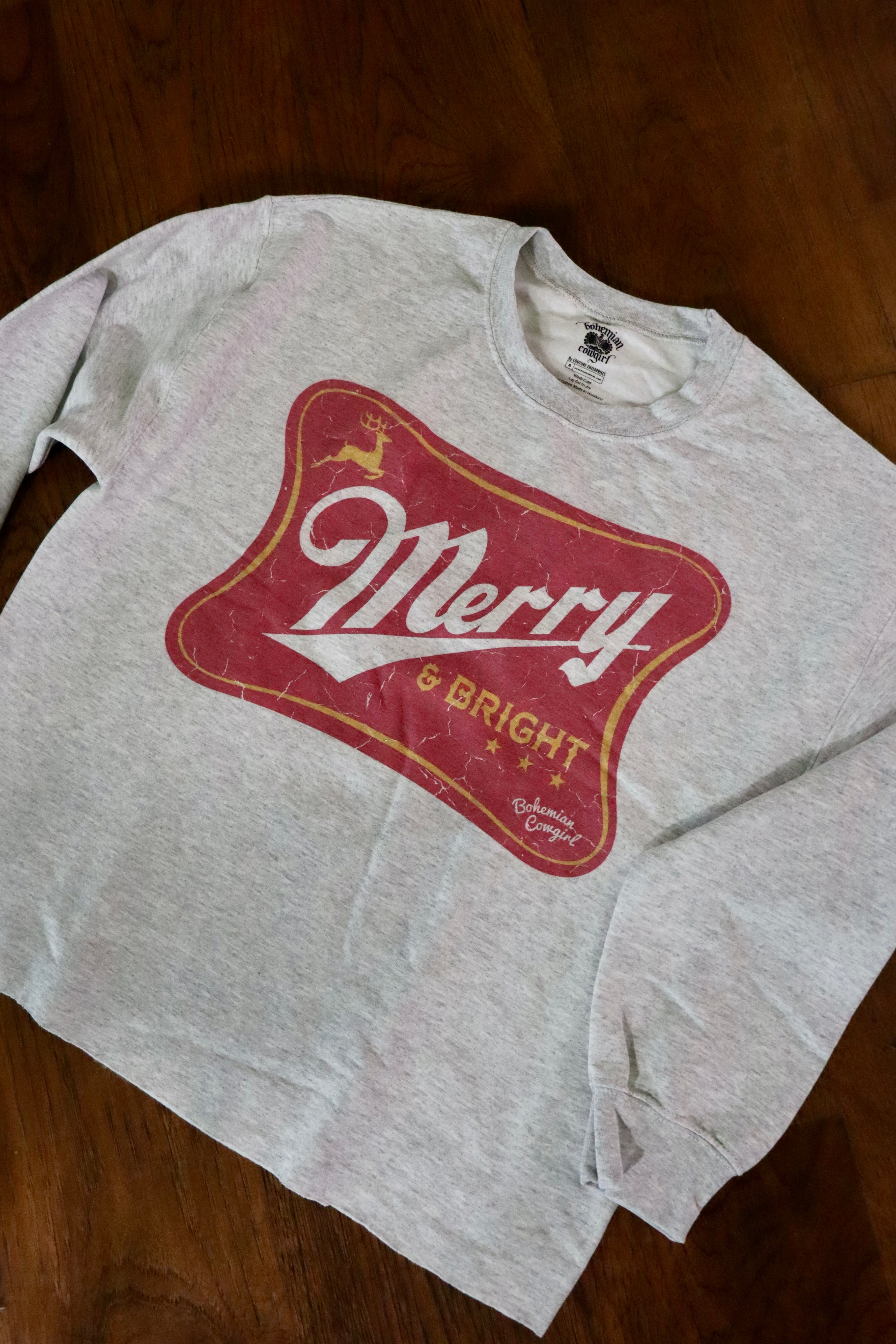 Merry &amp; Bright Sweatshirt.

True to size
Raw hem long crop.
100% Cotton
Wash cold, hang or lay flat to dry- NO DRYER.
Made by Bohemian Cowgirl.
