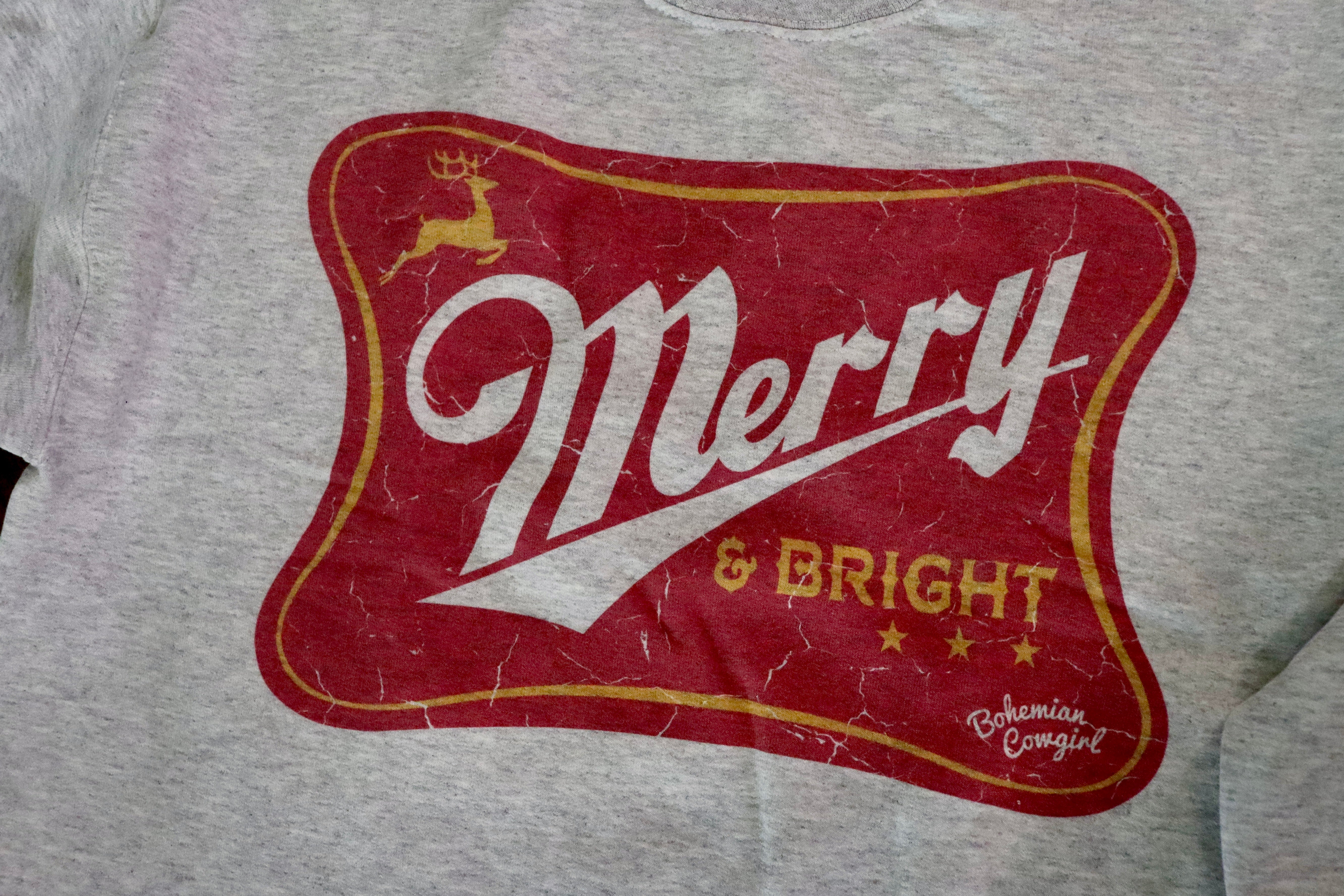 Merry &amp; Bright Sweatshirt.

True to size
Raw hem long crop.
100% Cotton
Wash cold, hang or lay flat to dry- NO DRYER.
Made by Bohemian Cowgirl.