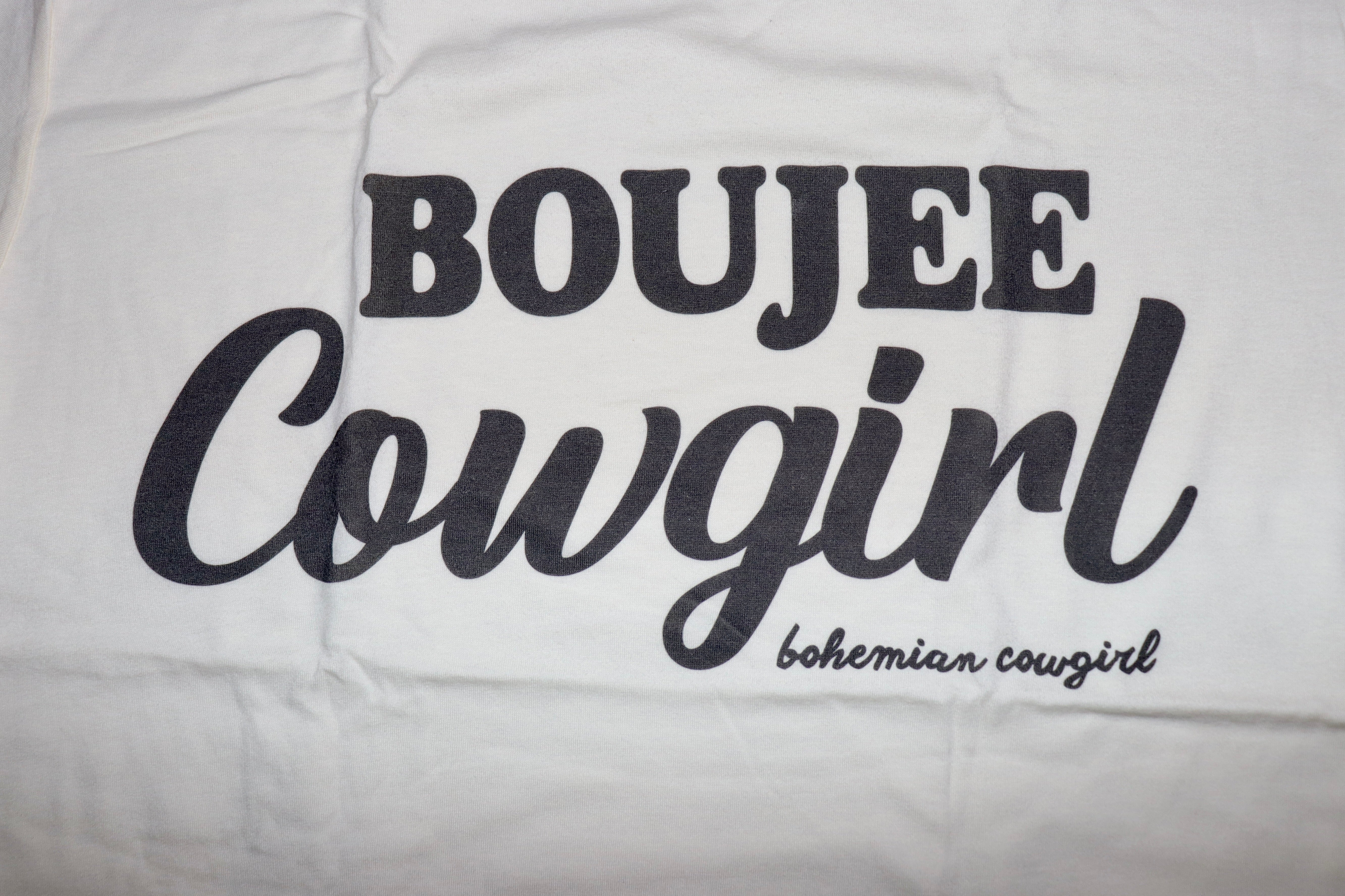 Bougee Cowgirl t-shirt.

Cream color with dark grey print.
Raw hem long crop.
True to size.
100% Cotton
Wash cold, hang or lay flat to dry- NO DR