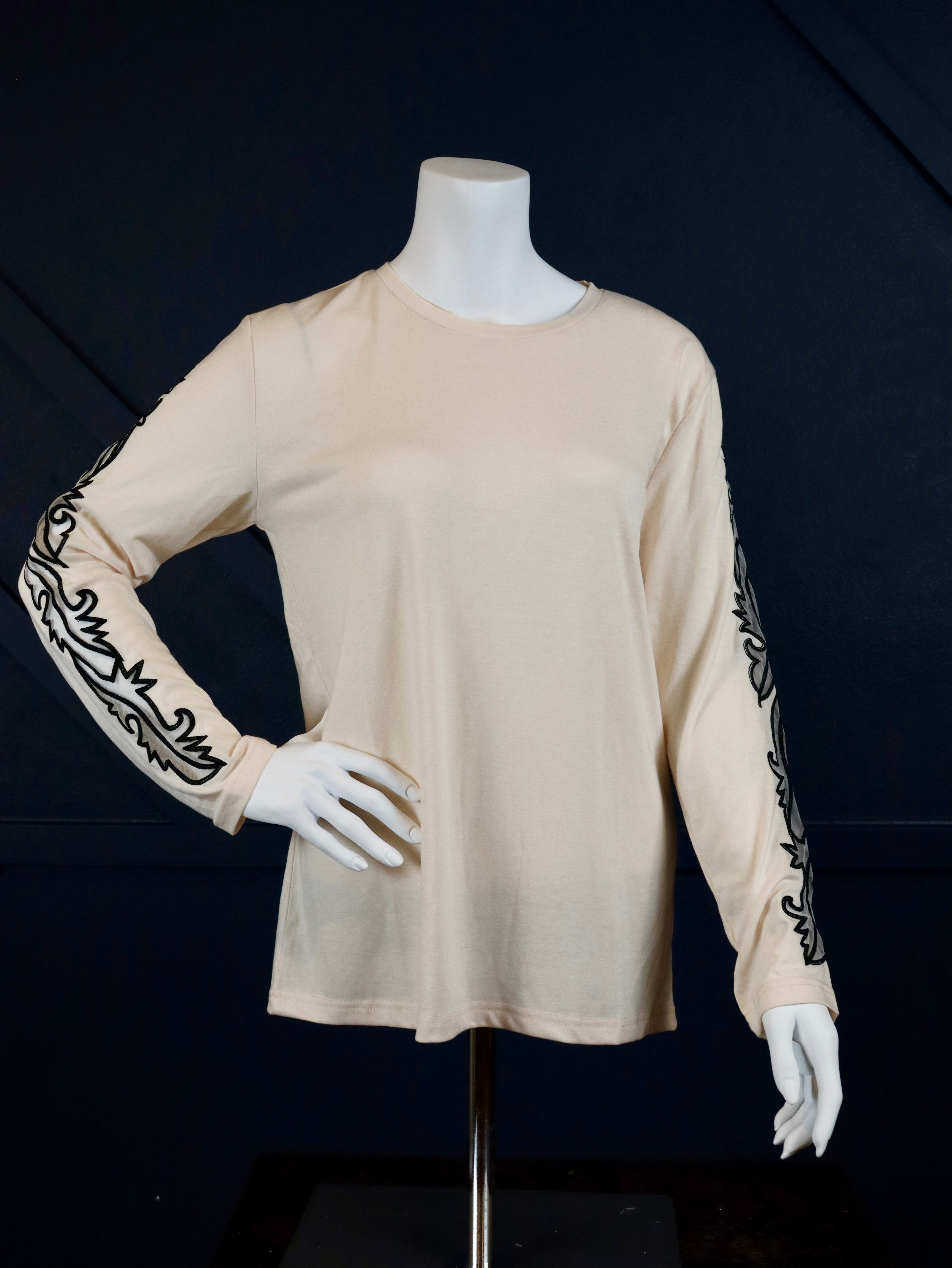 Cream long sleeve top with boot stitch sleeves.

True to size.
75% POLYESTER&nbsp;20% RAYON 5% SPANDEX
Made by 2 Fly