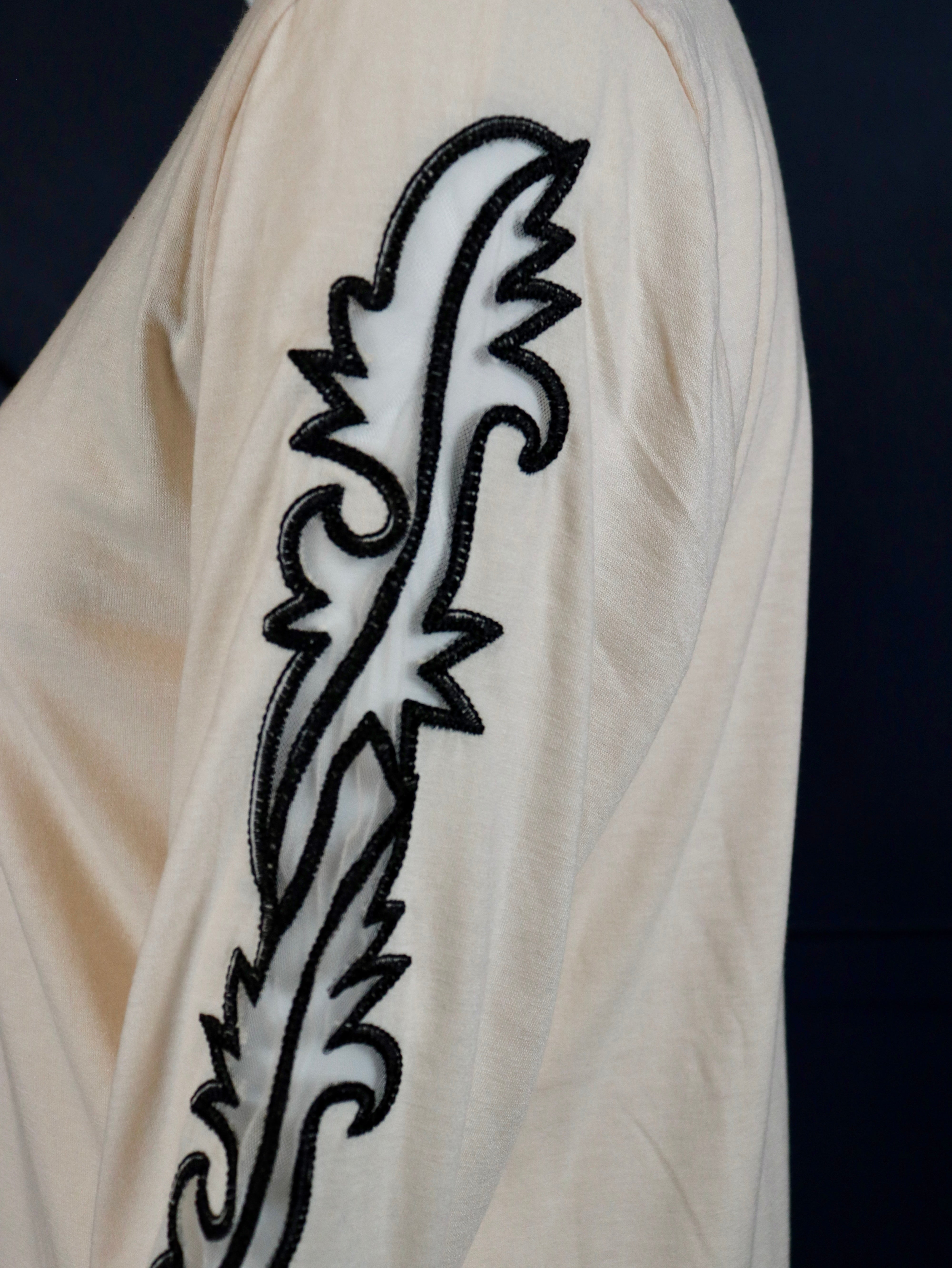Cream long sleeve top with boot stitch sleeves.

True to size.
75% POLYESTER&nbsp;20% RAYON 5% SPANDEX
Made by 2 Fly