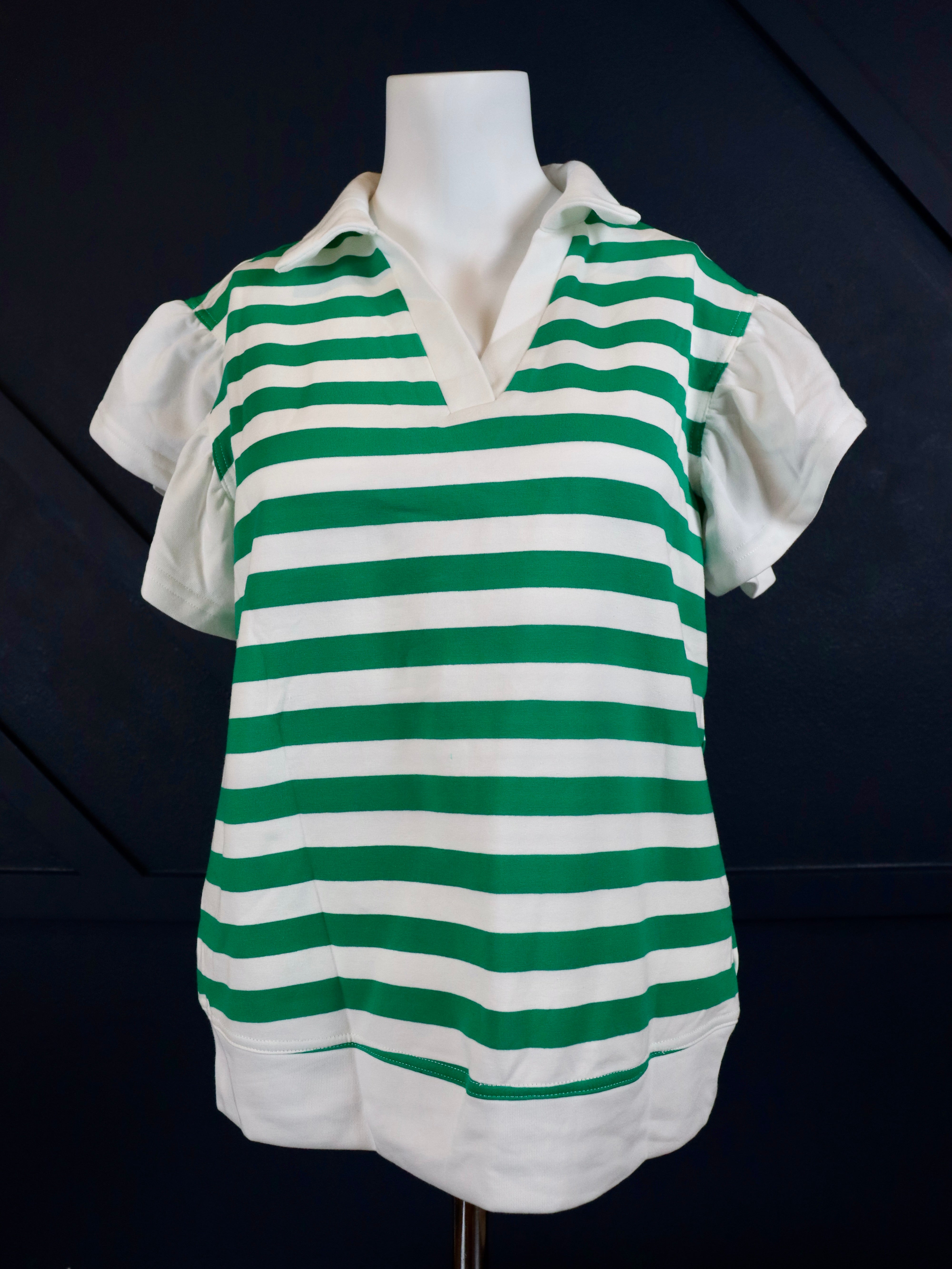 Short ruffle sleeve collared v-neck blouse.

Crafted from a soft breathable 95% cotton 5% elastane&nbsp;blend.
Relaxed fit.&nbsp;
Delicate wash, tumble dry low.