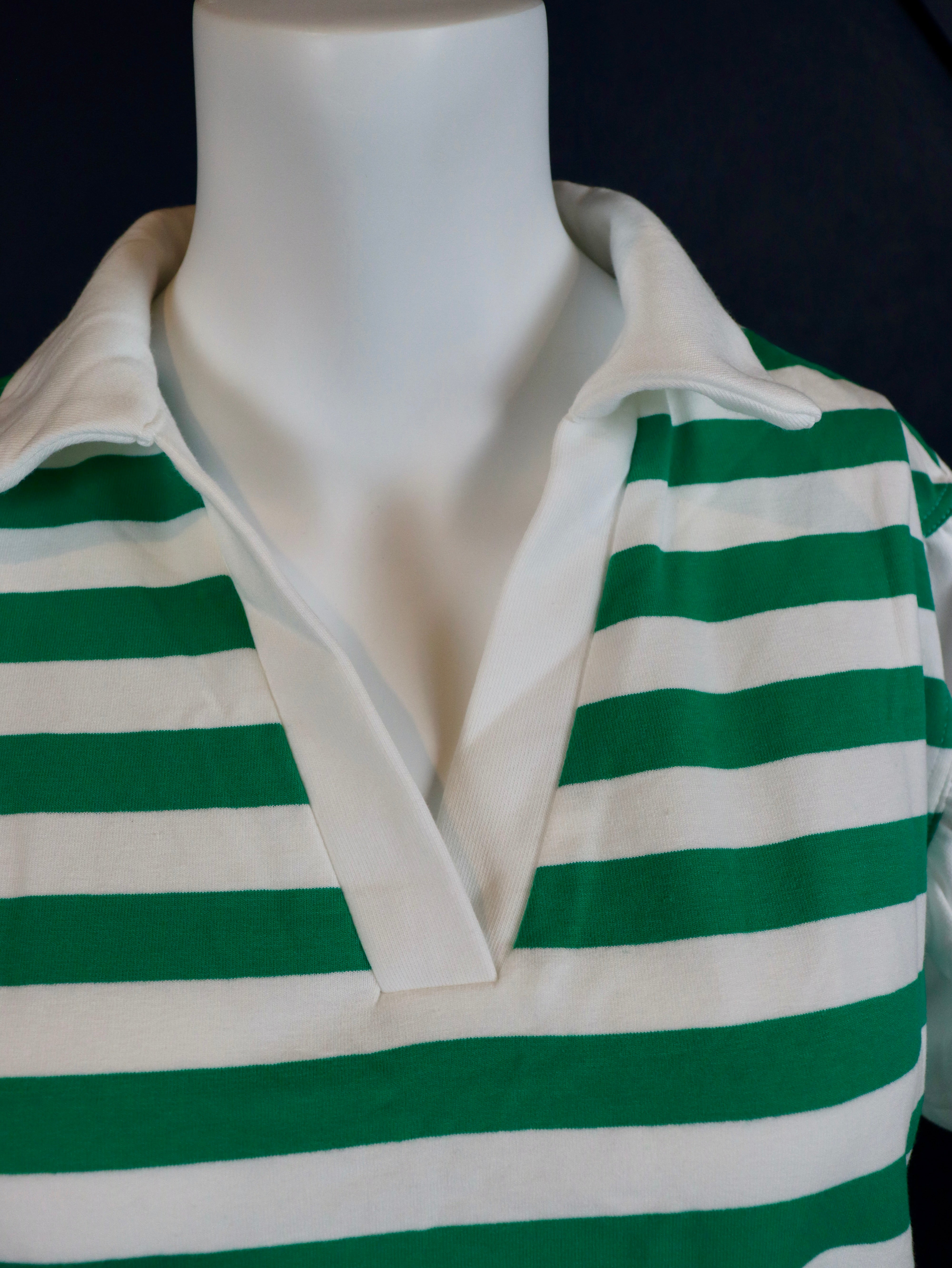 Short ruffle sleeve collared v-neck blouse.

Crafted from a soft breathable 95% cotton 5% elastane&nbsp;blend.
Relaxed fit.&nbsp;
Delicate wash, tumble dry low.