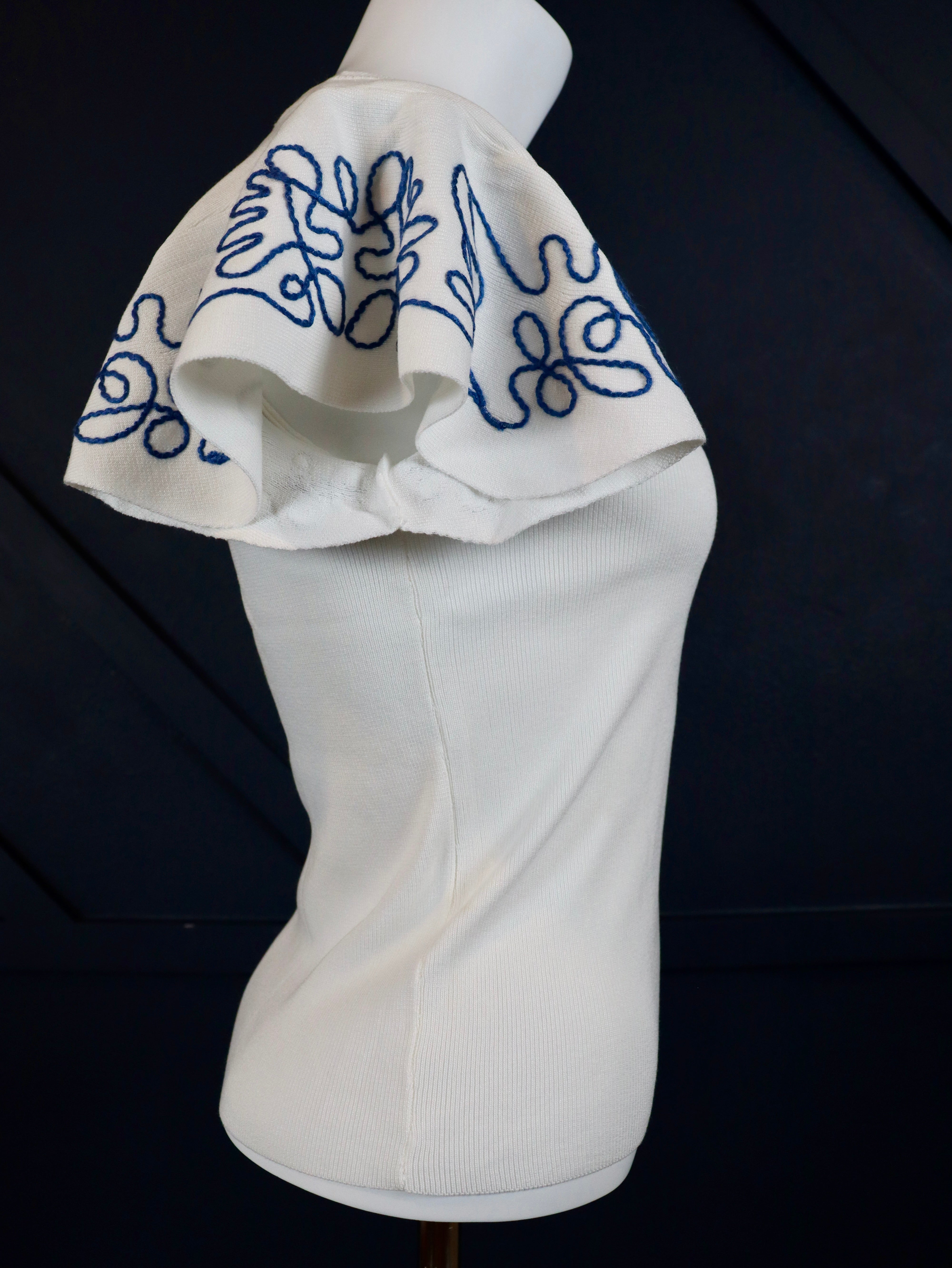 Lightweight woven top with blue embroidered ruffle sleeves.
Blue intricate embroidery on the sleeves.
Everyday breathable woven top.
70% Viscose, 30% Nylon
Small = 2-4 (Bust 35", Waist 27")
Medium = &nbsp;(Bust 37", Waist 29")
Large = (Bust 39", Waist 31")
Made by Hem and Thread.