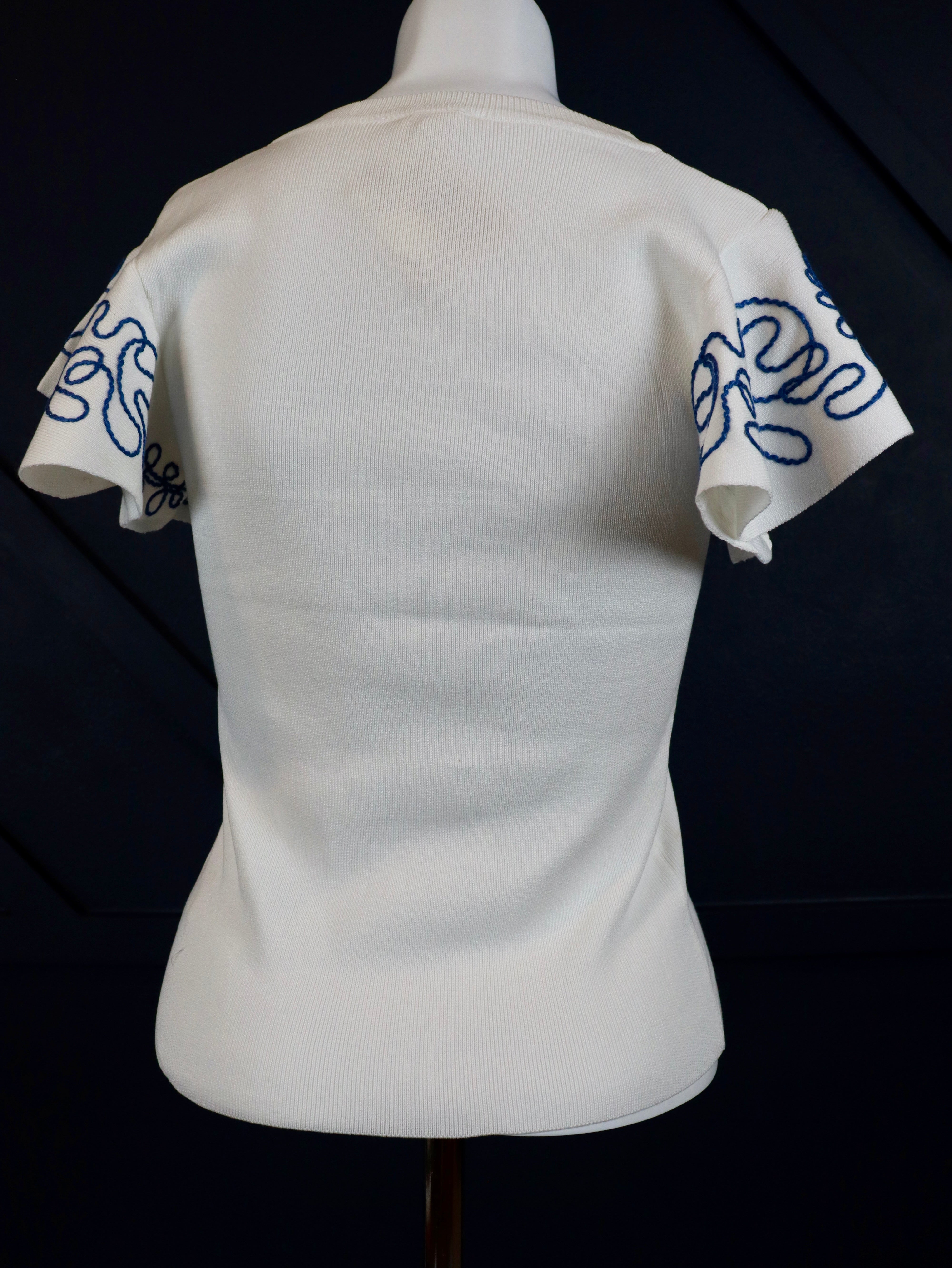 Lightweight woven top with blue embroidered ruffle sleeves.
Blue intricate embroidery on the sleeves.
Everyday breathable woven top.
70% Viscose, 30% Nylon
Small = 2-4 (Bust 35", Waist 27")
Medium = &nbsp;(Bust 37", Waist 29")
Large = (Bust 39", Waist 31")
Made by Hem and Thread.