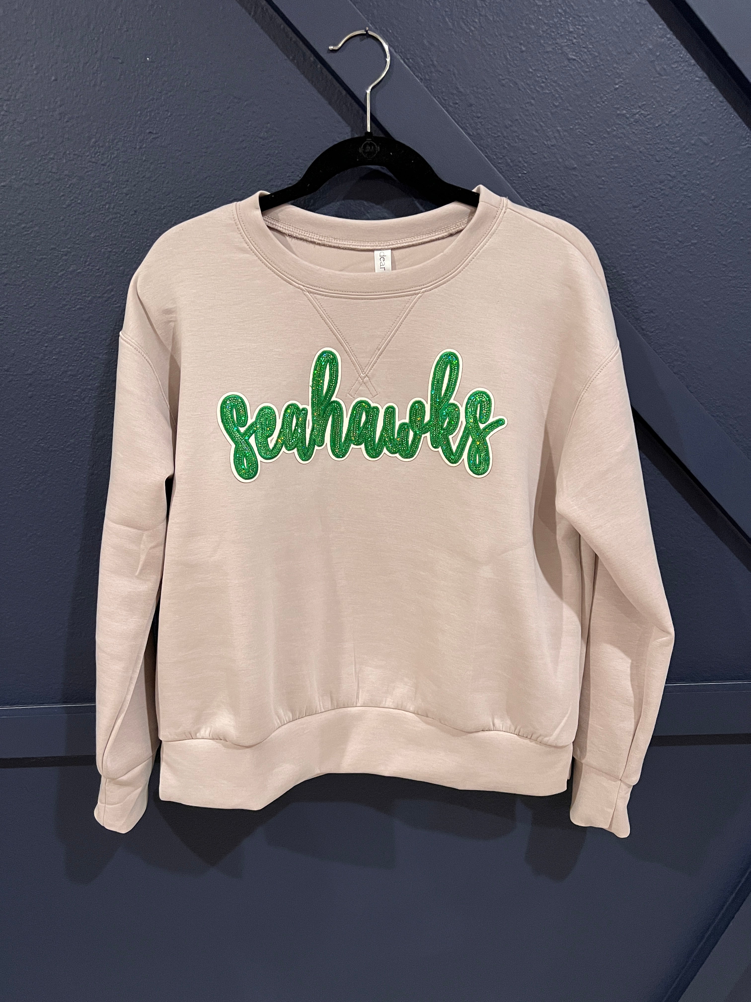 Elevated athleisure sweatshirt with Seahawks sequin appliqué.

Super soft modal.
True to size.
95% Polyester, 5% Spandex
Cool delicate wash (inside out), hang to dry.
CUSTOM order.