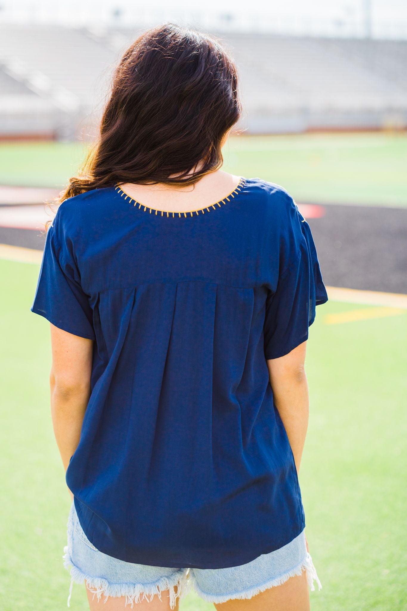 Navy with yellow embroidery.  HAND WASH ONLY in cold water (by hand, no machine) and hang to dry 100% Rayon Made by Layerz S (4-6) bust: 36" length: 21 1/2" sleeve length: 4 3/4" sleeve opening: 8 1/2" M (8-10) bust: 40" length: 23 1/2" sleeve length: 5 1/4" sleeve opening: 9" L (12-14) bust: 42" length: 24" sleeve length: 5 1/2" sleeve opening: 9" XL (16-18) bust: 45" length: 24 3/4" sleeve length: 5 3/4" sleeve opening: 9 1/2"