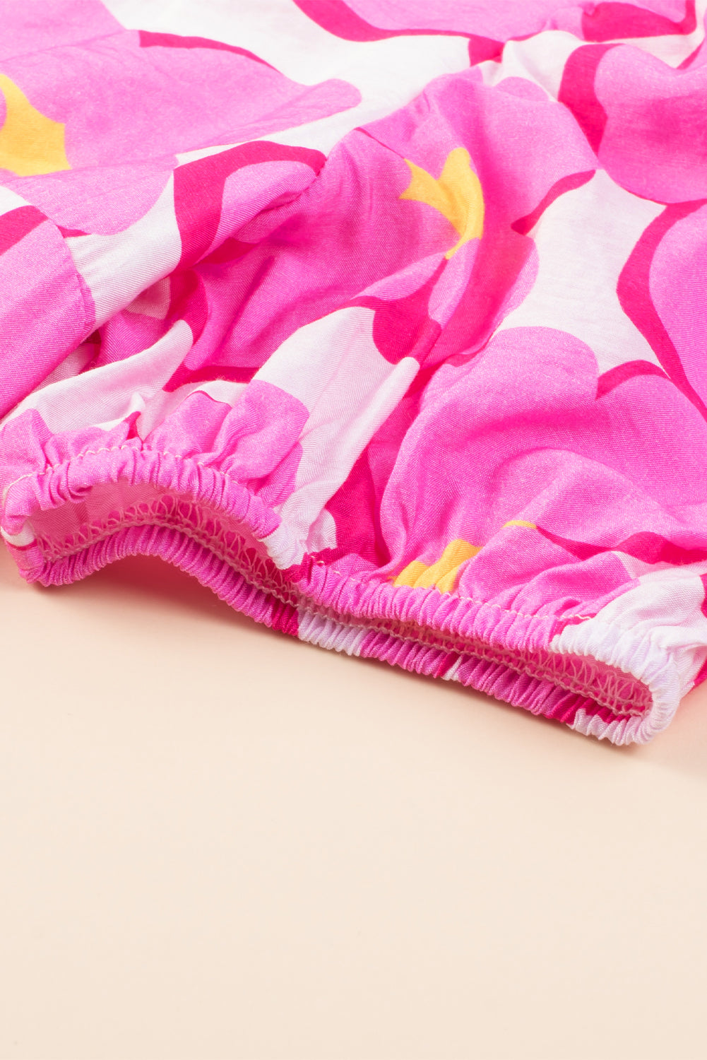 Pink floral empire waist dress.

Size 4
Bust: 34", Length: &nbsp;35", Sleeve Length: &nbsp;11"
81% Viscose. 19% Polyamide
Delicate wash, hang to dry.