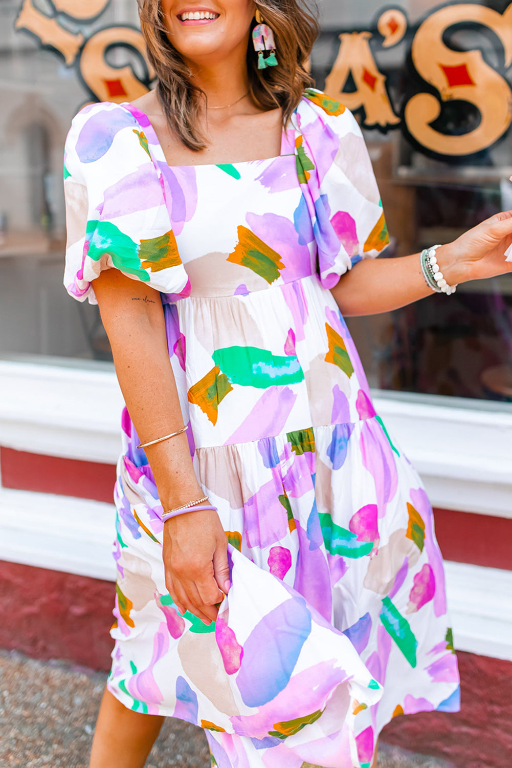 Purple abstract print puff sleeve smocked back dress.

Size 8
Bust: 34", Length: &nbsp;39", Sleeve Length: &nbsp;12"
100% Polyester
Delicate wash, hang to dry.