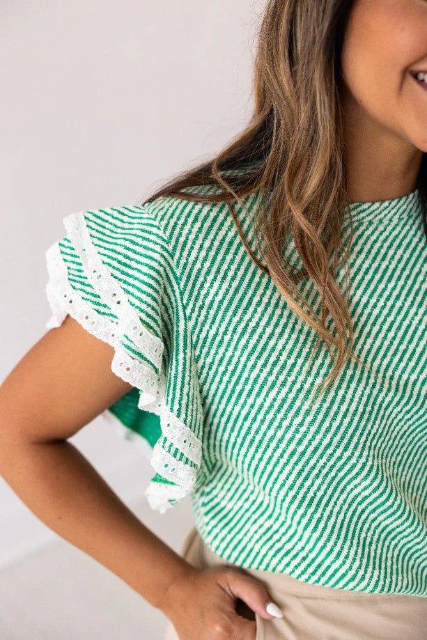 Flattering green &amp; white top

Relaxed fit and long crop.
Lace trim ruffle sleeves.
True to size.
Made by Grace + Emma.
THML