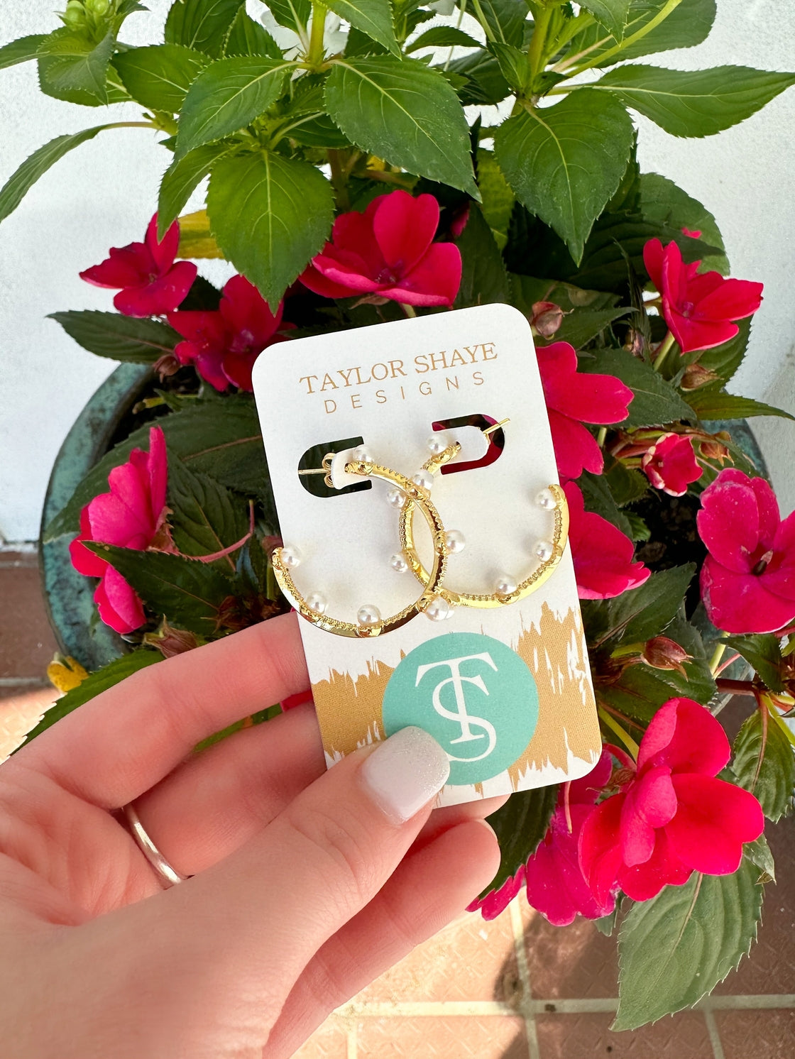 Gold and pearl hoops.

Classic and will compliment any style.
Made by Taylor Shaye in the USA.