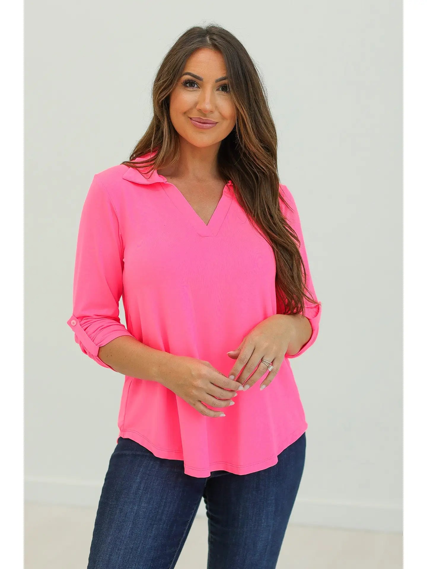 Comfortable, flattering neon pink top.

True to size
Roll tab to 3/4 sleeve.
&nbsp;96% Polyester 4% Spandex
Delicate wash and hang to dry
Made by Southern Grace