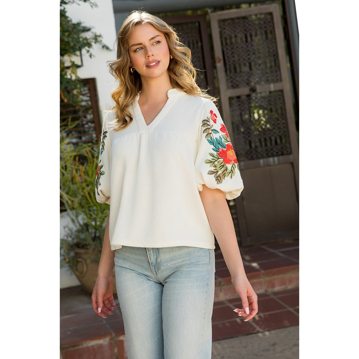 Soft cream top with embroidered puff sleeves by THML.&nbsp;

Embroidered sleeves are exquisite!
True to size.
95% Polyester, 5% Spandex
Cool delicate wash, lay flat to dry, NO dryer
Made by THML