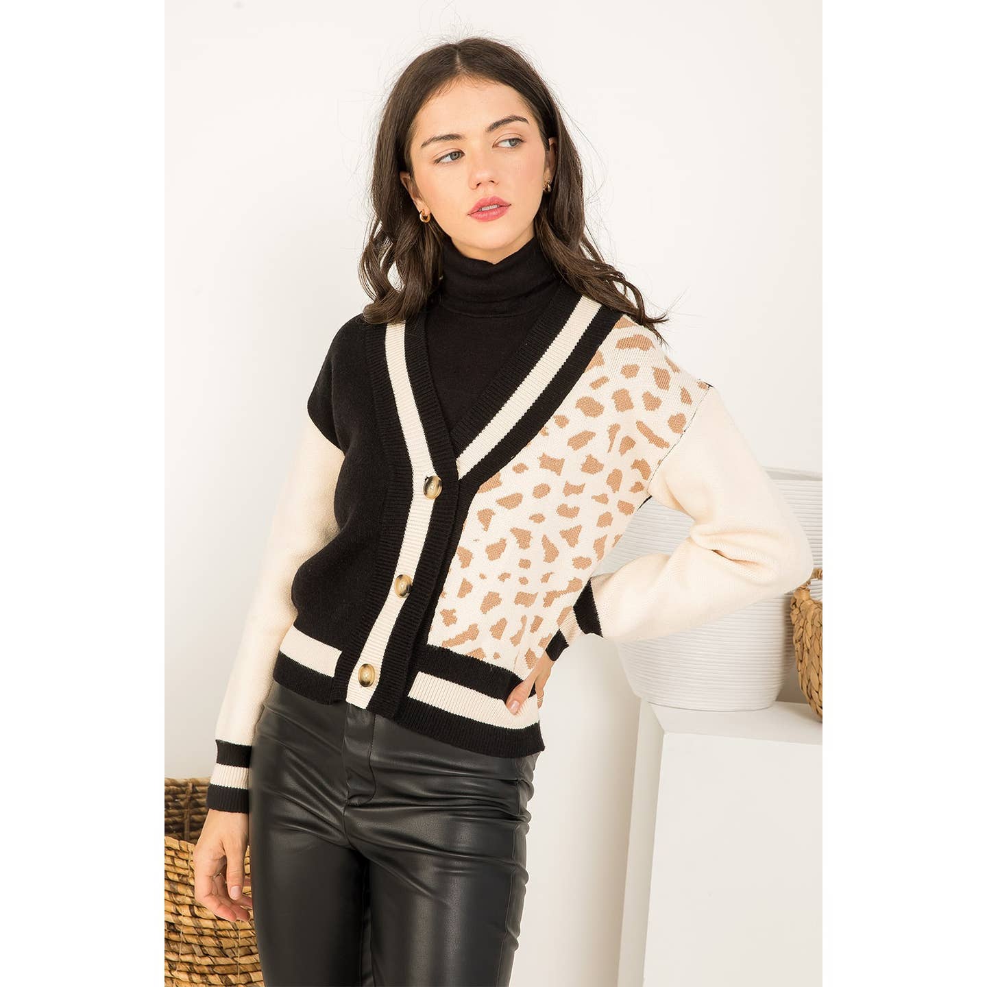 Block leopard print knit cardigan by THML.&nbsp;

Fun Varsity/Letterman style cardigan.
Roomy.
55% Viscose, 28% Polyester, 17% Nylon
Cool delicate wash, lay flat to dry, NO dryer.
Made by THML