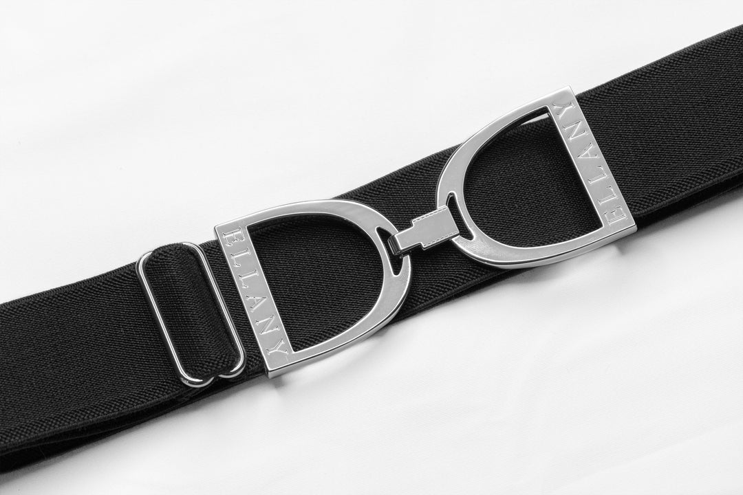 THE belt you didn't know you needed!  1.5" elastic with beautiful silver equestrian buckle. Adjustable 24"-65"!  One size fits most. Ultra comfy, machine washable, no buckle budge, no gap in the back of your pants. Made by Ellany in the USA.