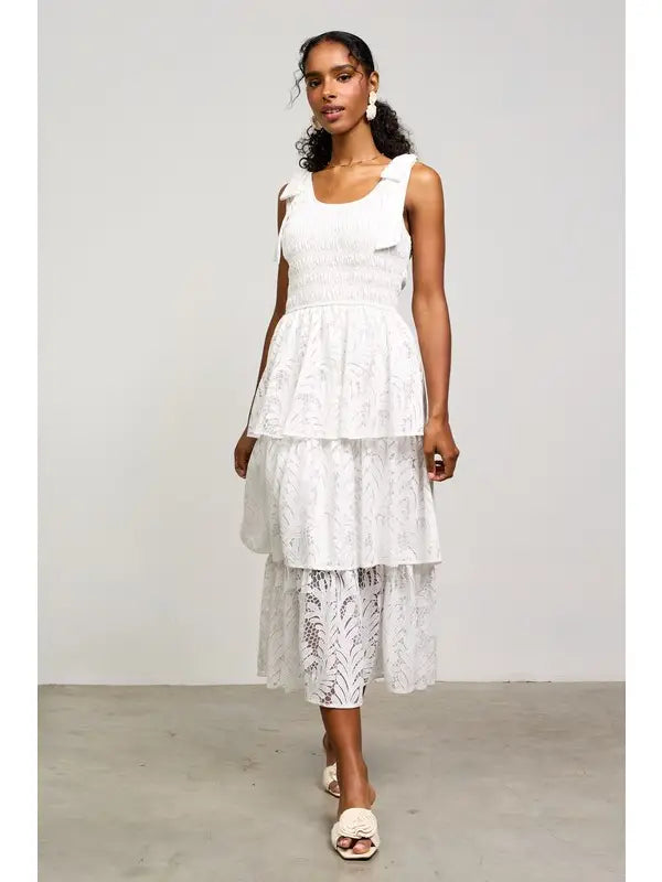 White lace tiered midi dress with bow straps.

X-Small (Size 2-4) Bust: &nbsp;33.5", Waist: &nbsp;26", Hips 36"
Small (Size 4-6) Bust: 35.5", Waist: &nbsp;27.5", Hips: 37.5"
Medium (Size 8-10) Bust: 37.5", Waist: &nbsp;29.5", Hips: 39.5"
Large (Size 12)Bust: 39.5" Waist: &nbsp;31.5", Hips: &nbsp;41.5"
80% Cotton, 20% Polyester
Delicate wash, hang to dry.
Made by Skies are Blue