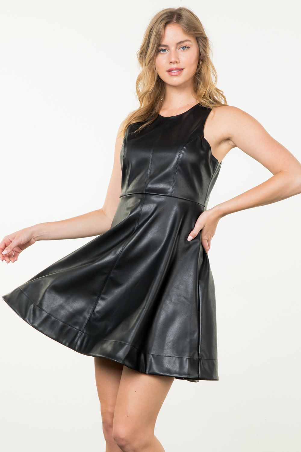 Black faux leather midi dress by THML.&nbsp;

Universally flattering A-line dress.
Smaller in the bust, so size up if you are well endowed;)
50% Polyester, 50% Polyurethane
X-Small 2-4, bust 30"
Small 6-8, bust 32"
Medium 8-10, bust 34"
Large 10-12, bust 36"
Made by THML