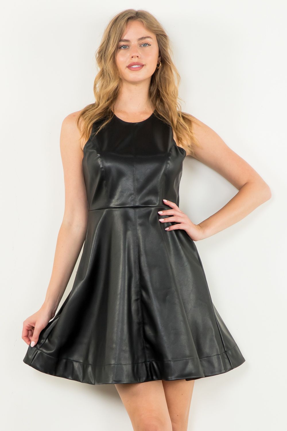 Black faux leather midi dress by THML.&nbsp;

Universally flattering A-line dress.
Smaller in the bust, so size up if you are well endowed;)
50% Polyester, 50% Polyurethane
X-Small 2-4, bust 30"
Small 6-8, bust 32"
Medium 8-10, bust 34"
Large 10-12, bust 36"
Made by THML