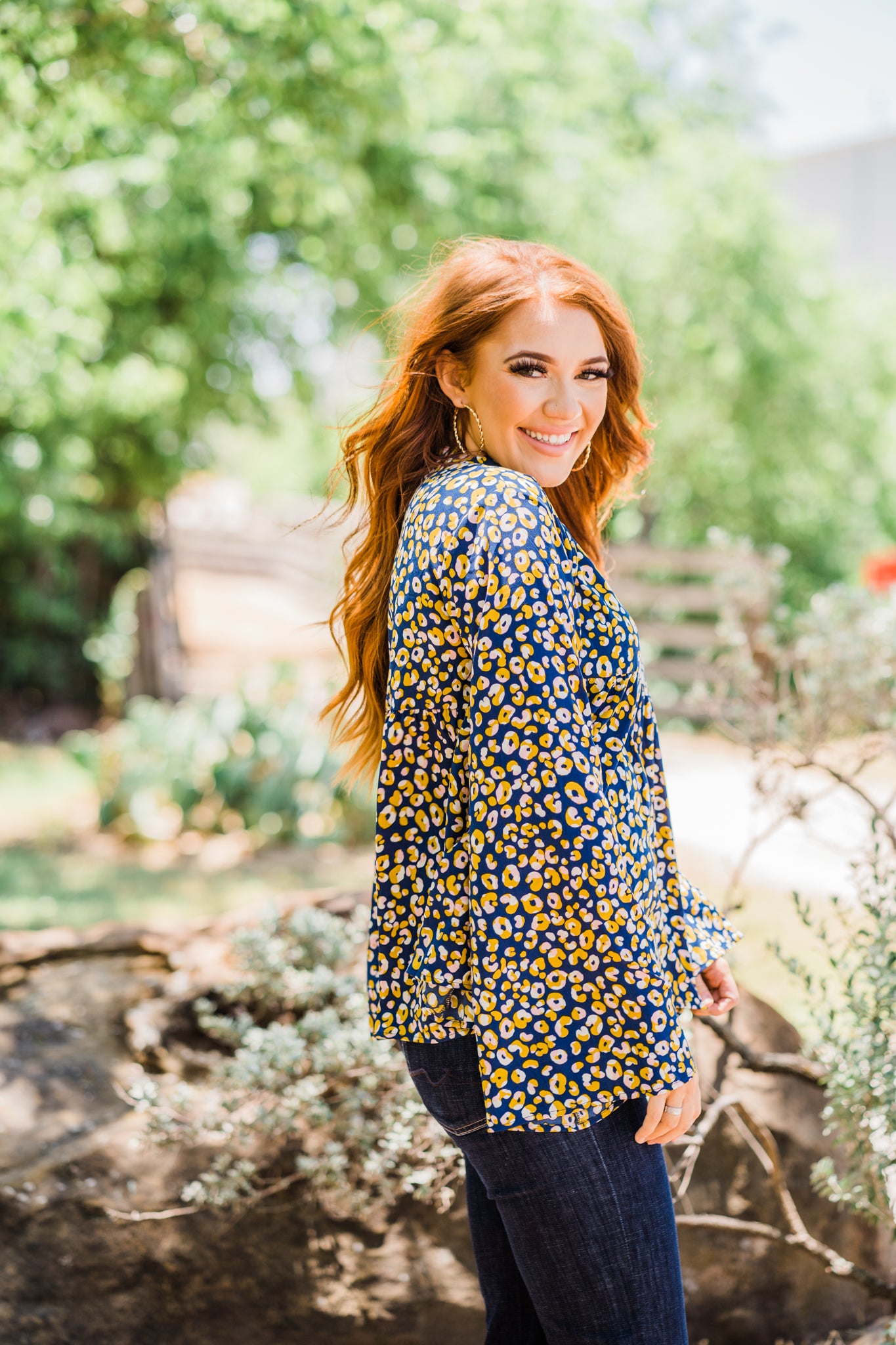 The Annebell Top is a beautiful navy bell sleeve top with yellow and pink leopard. This top is perfect for any occasion! Pair with some dark denim to or white pants compliment the look:)  HAND WASH ONLY in cold water (by hand, no machine) and hang to dry 100% Rayon Made by Layerz