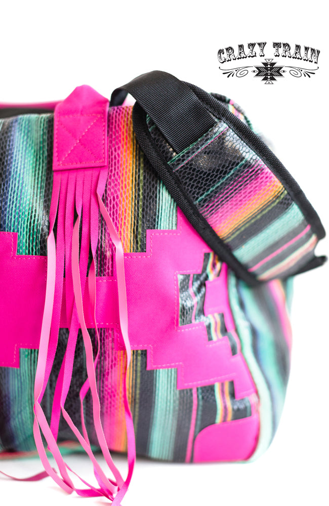 HUGE hot pink serape bag with FRINGE:)  Measurements: 28"L x 10"W x 12"D Adjustable strap  100% Polyester Fully lined, but no inner pockets