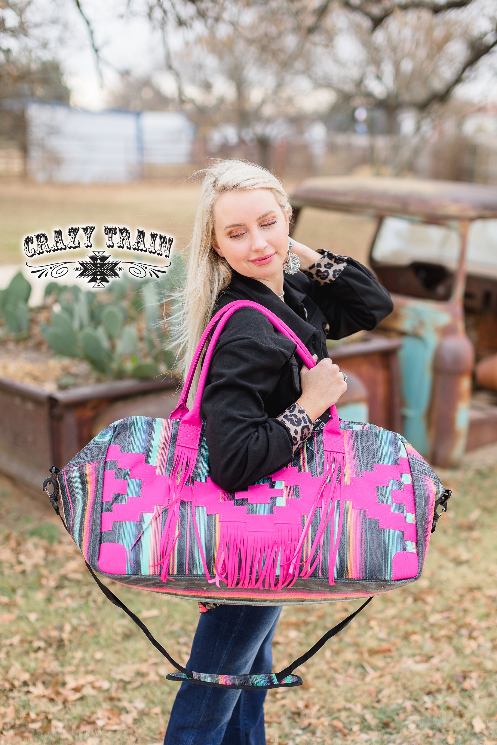 HUGE hot pink serape bag with FRINGE:)  Measurements: 28"L x 10"W x 12"D Adjustable strap  100% Polyester Fully lined, but no inner pockets