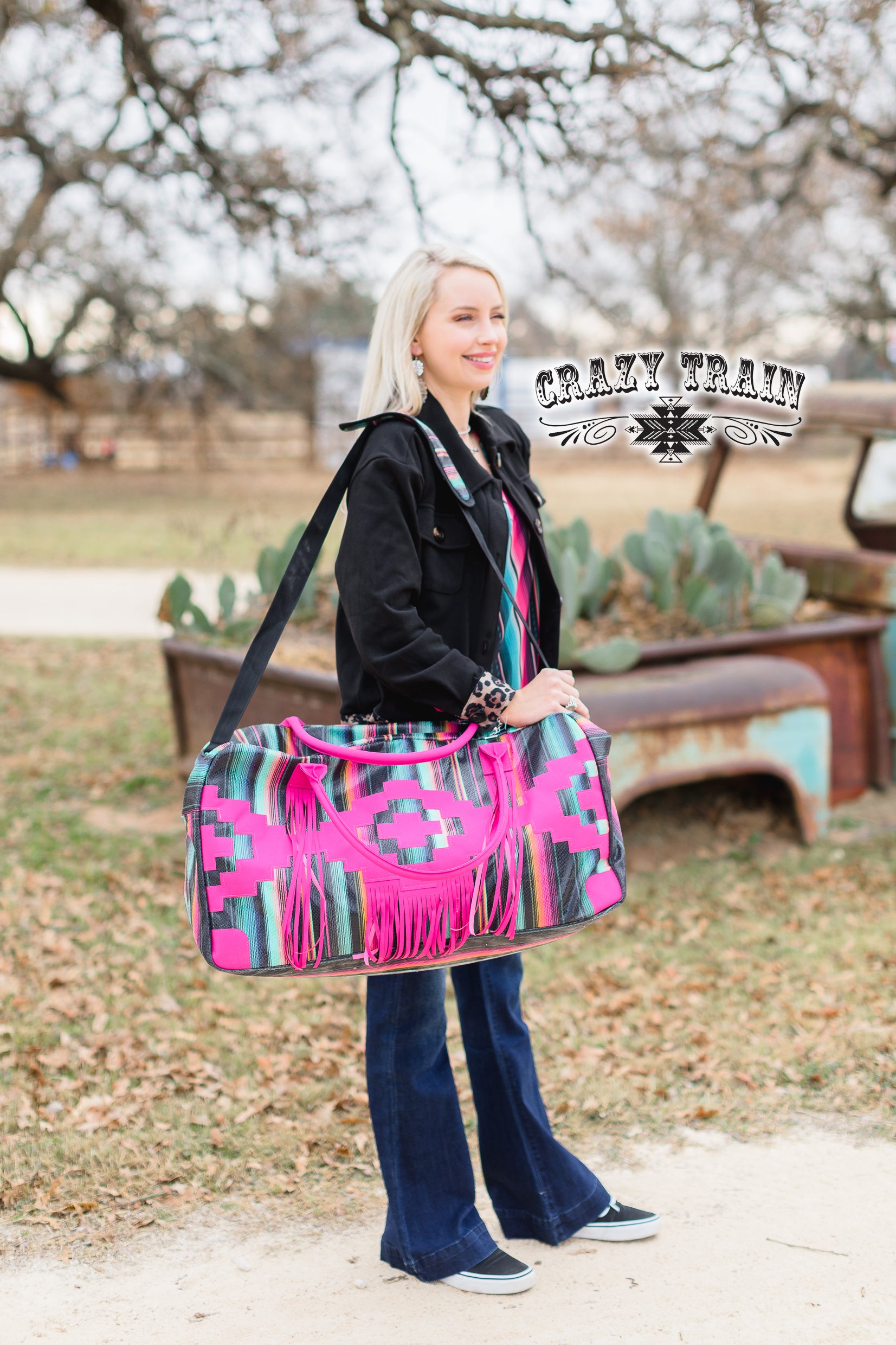 HUGE hot pink serape bag with FRINGE:)  Measurements: 28"L x 10"W x 12"D Adjustable strap  100% Polyester Fully lined, but no inner pockets