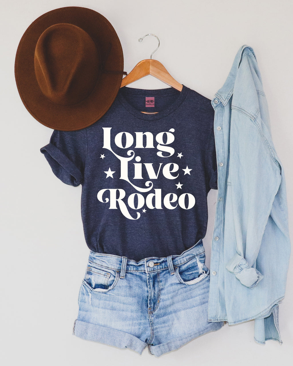 Love Live Rodeo Tee features a unisex fit body in heather denim with cream screen printed art.